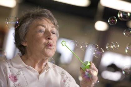 woman blowing bubbles